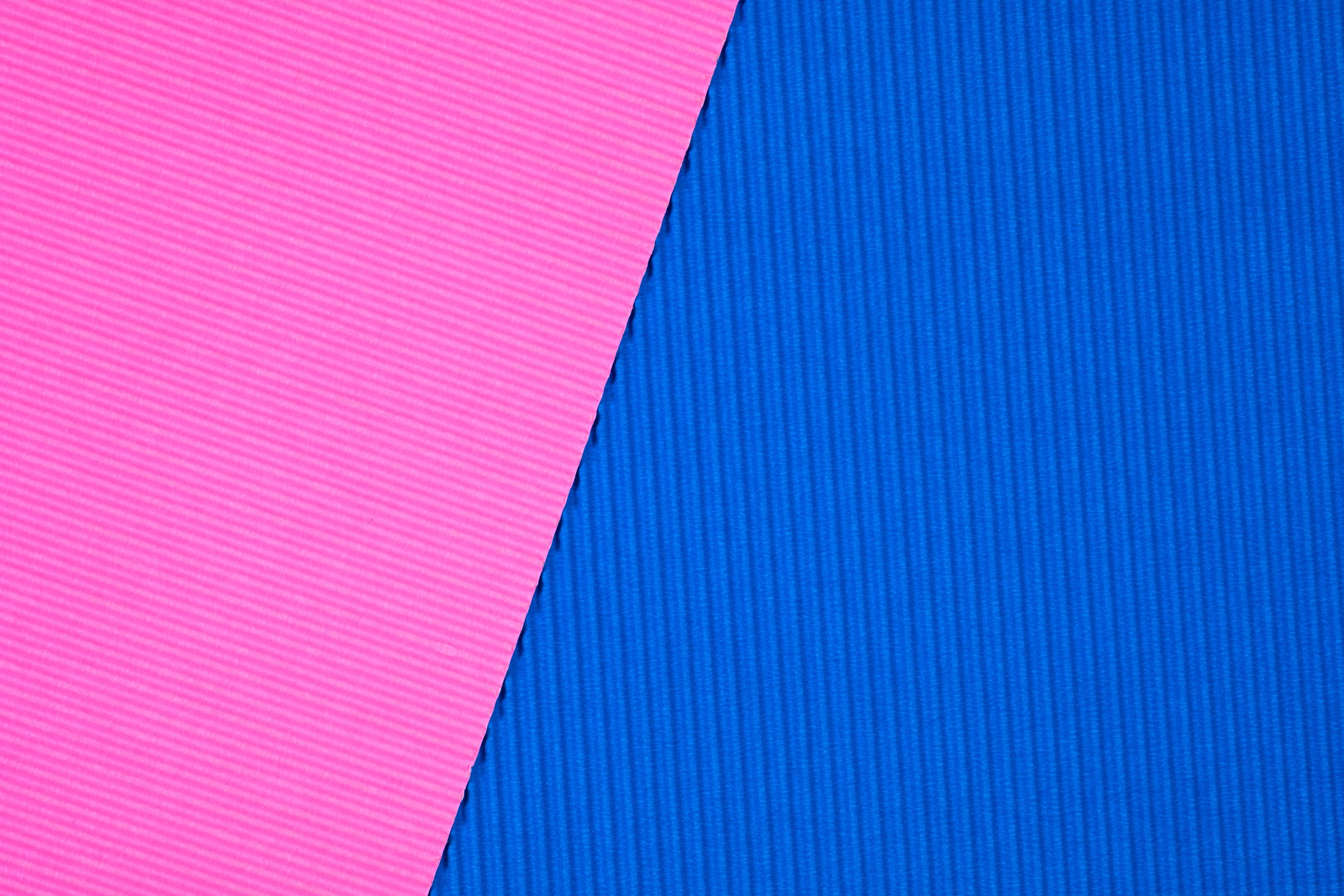 Blue and pink corrugated paper texture, use for background. vivid colour with empty space for add text or object.